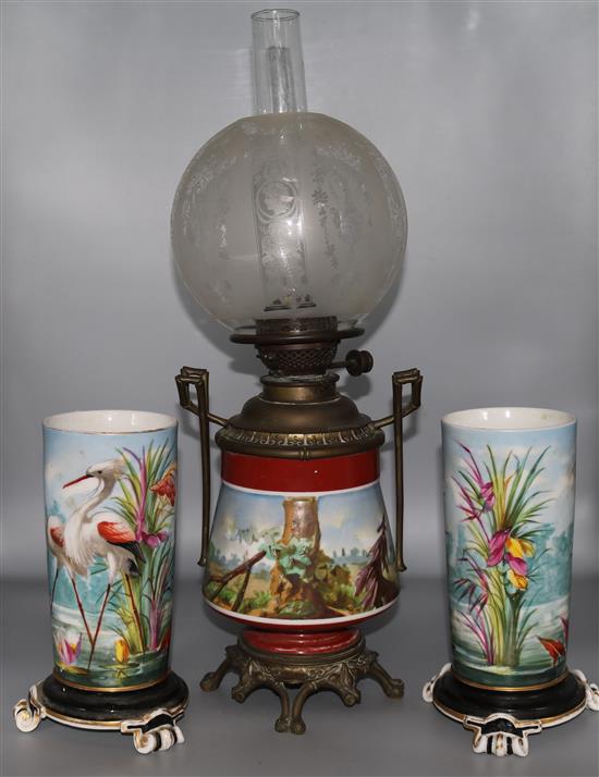 A Paris porcelain oil lamp and a similar pair of vases